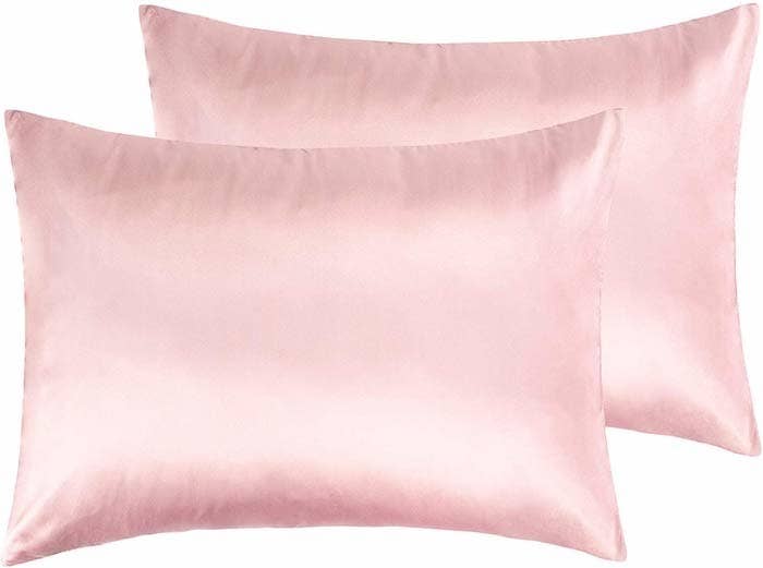 Two pink satin pillowcases.