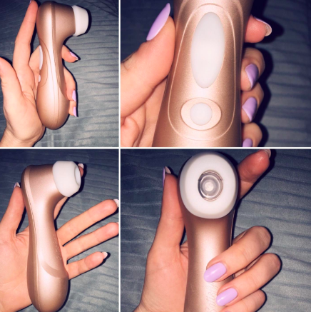 A reviewer showing the toy at different angles. It has a smooth silicone cap for comfort above the suction tip and a smooth oval handle. 