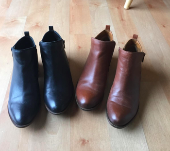 Reviewer photo of a black and brown pair of the boots