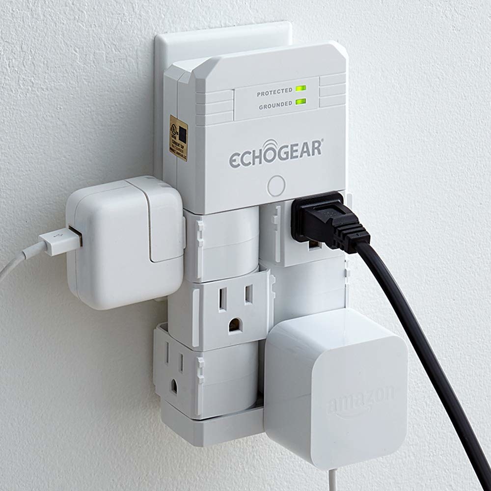 An outlet bank with three plugs plugged into it