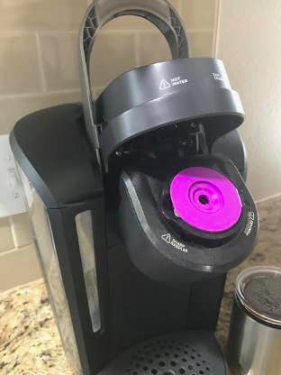 reviewer pic of the pod fitting in a Keurig machine easily