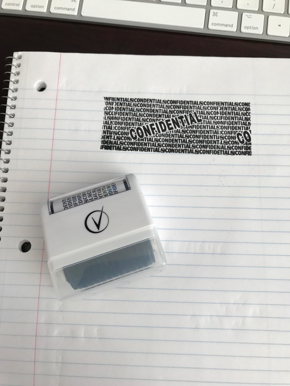 Reviewer photo of covered information using roller stamp