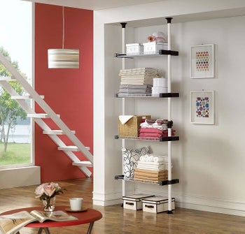 The four-shelf closet system secured in a wall nook