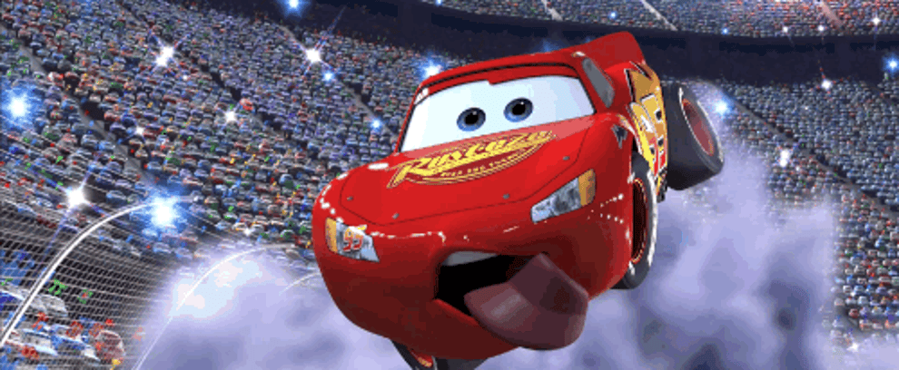 Disney&#x27;s Lightning McQueen from the movie Cars flying through the air winking at a crowd