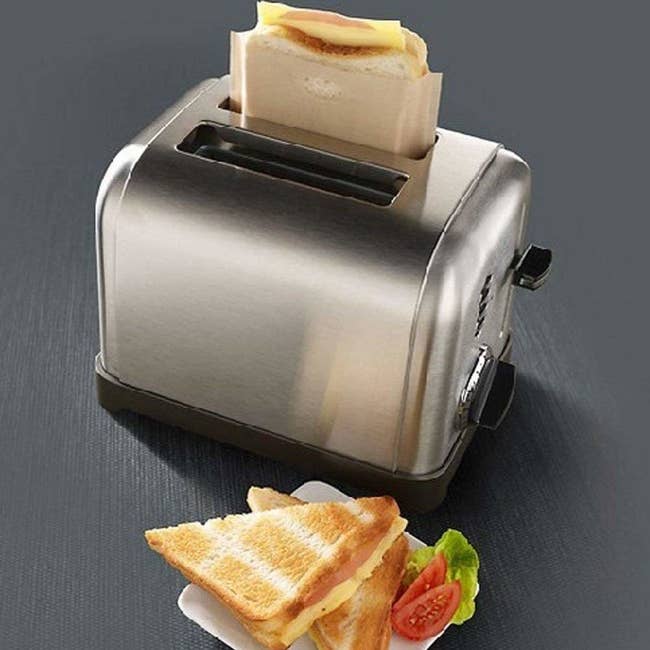A sandwich in a toaster bag in a toaster