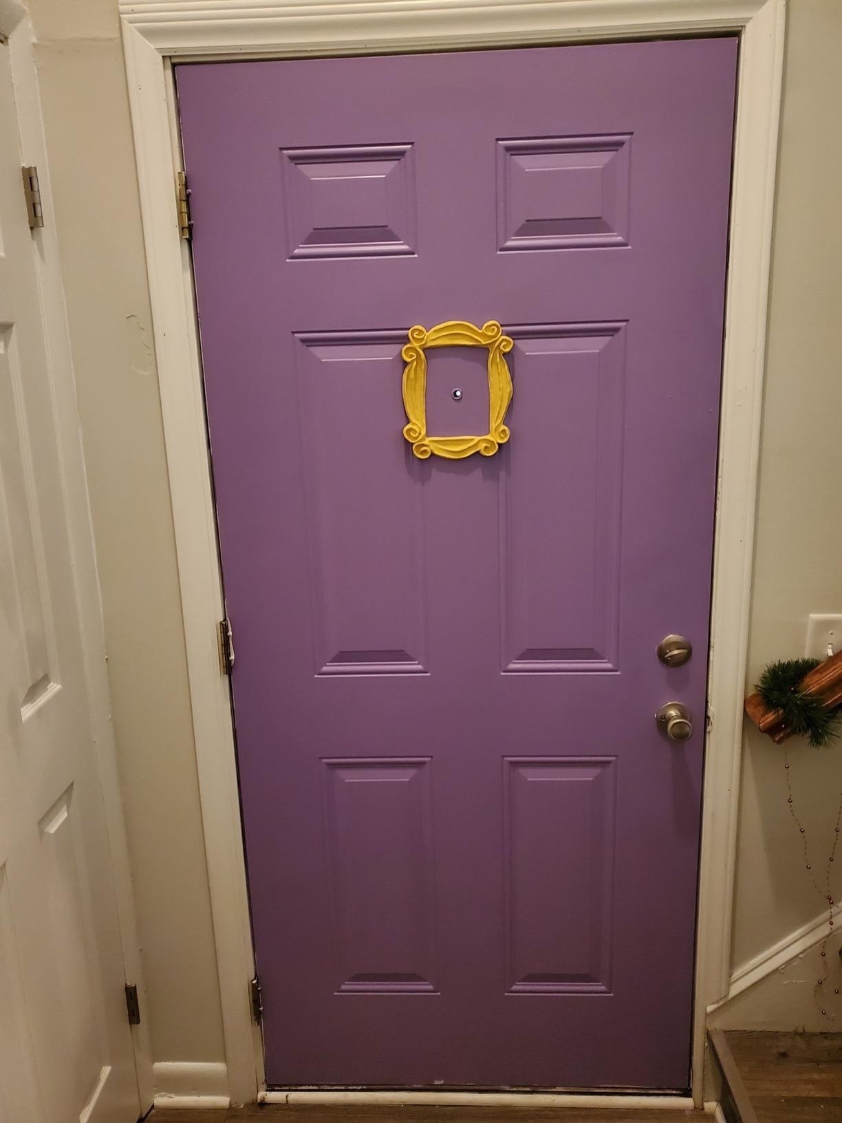 yellow frame on a purple door