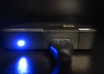 a gadget with a glowing blue light