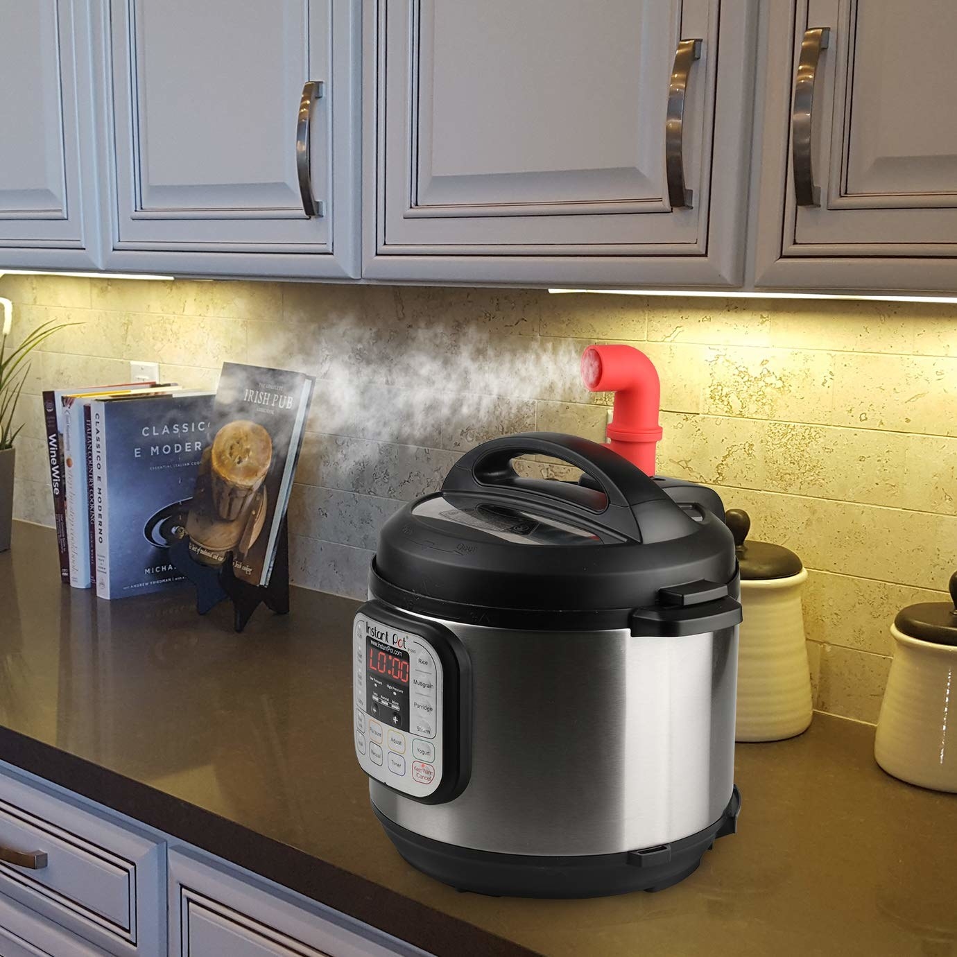 the red diverter curved to aim steam away from cabinets horizontally