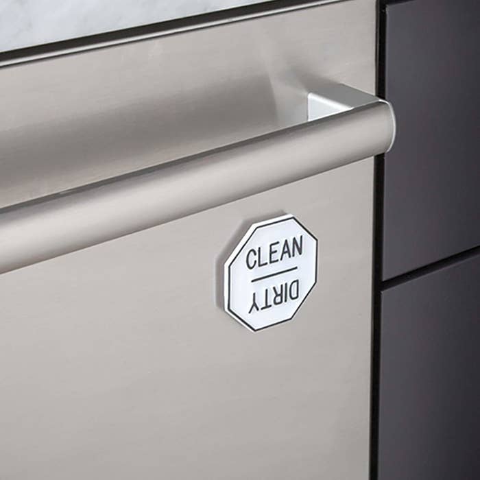 The magnet on a dishwasher, which shows the word &quot;clean&quot; on one side and the word &quot;dirty&quot; when rotated 