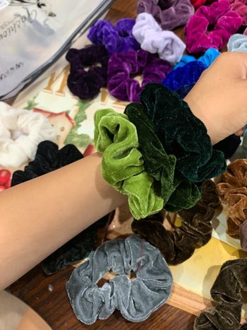 the scrunchies on a reviewer's wrist
