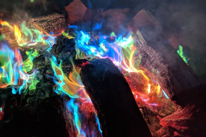 A campfire with rainbow flames