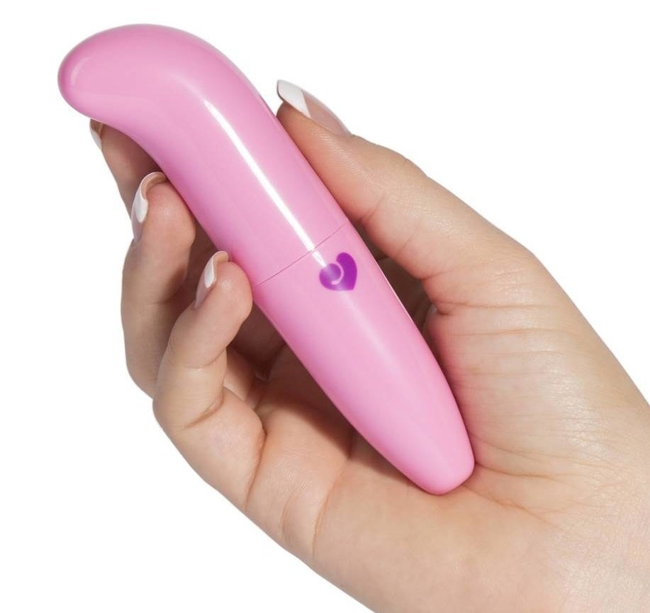 Hand holding the small vibe with curved tip in pink