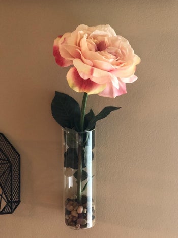 reviewer image of a single flower in a vase hanging from the wall 