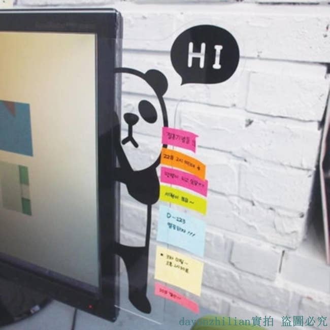 An illustration of a panda in black on a clear board attached to a monitor with the word 