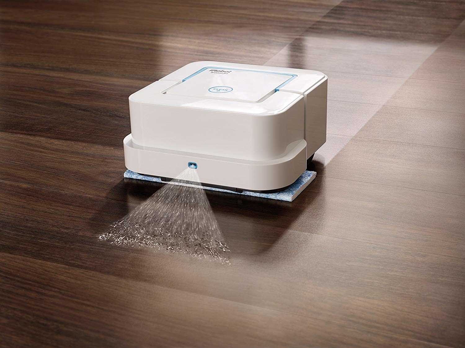 the white robot mop machine cleaning a wood floor