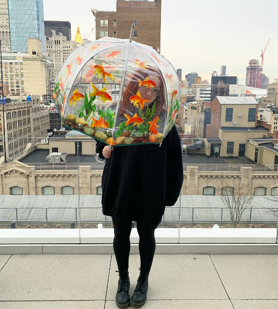 myself holding the clear umbrella with a goldfish print