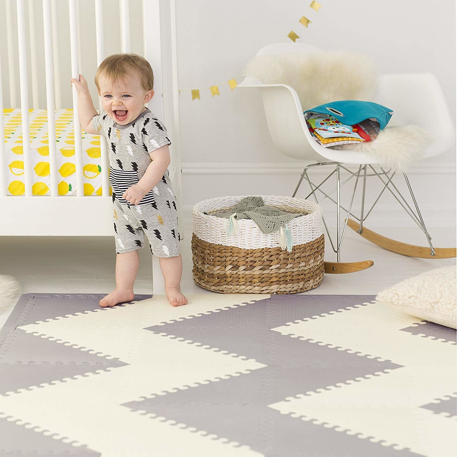 Child model standing on white and gray patterned floor mat
