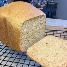 A loaf of baked bread sliced