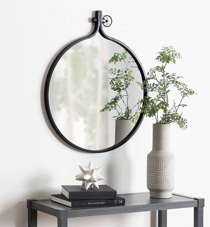 Round mirror with hook attachment on top 