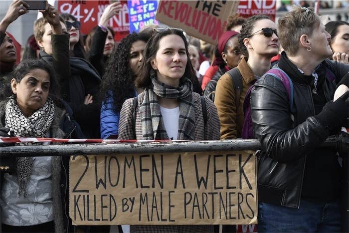 A woman seen holding a placard during the Million Women&#x27;s Rise march in London.