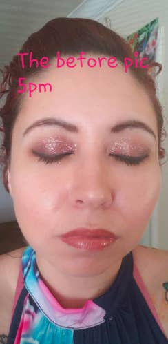 A reviewer with a full face of makeup, including eyeliner and glitter eyeshadow, with the text 