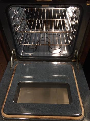 after image of same oven looking shiny and clean