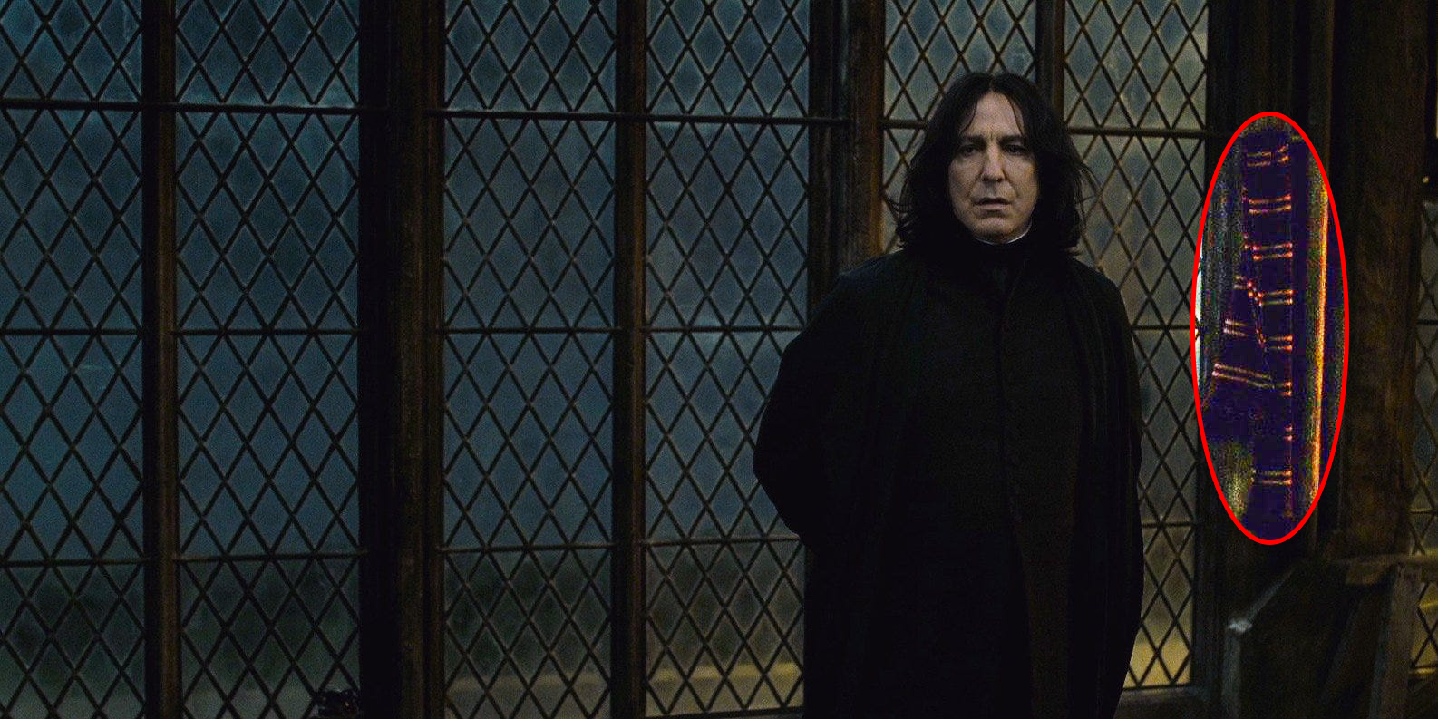 Snape next to a red and gold scarf