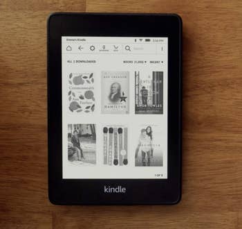 The black Kindle paperwhite with a digital library on the screen 