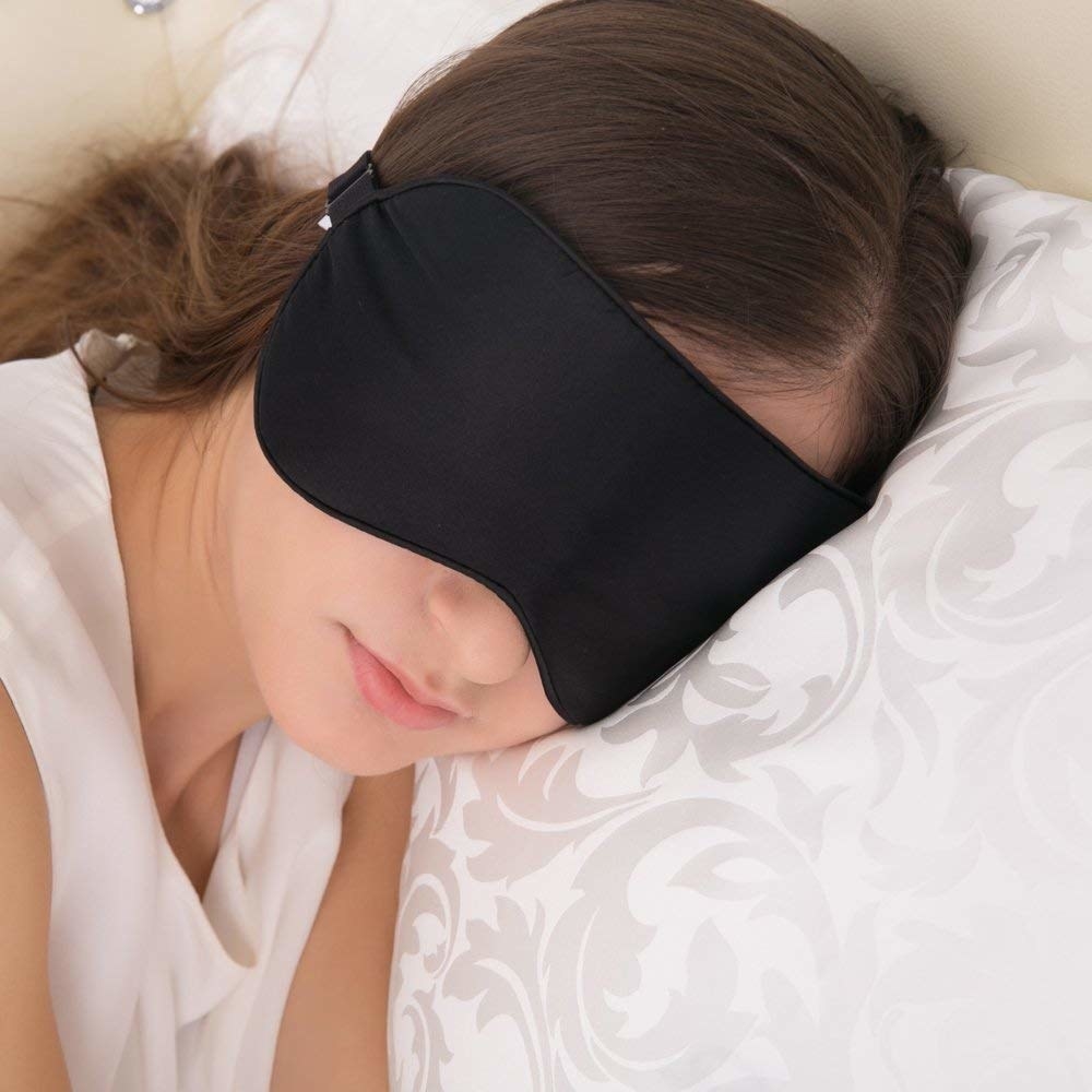 A woman wearing a sleep mask