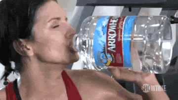 A woman chugging water