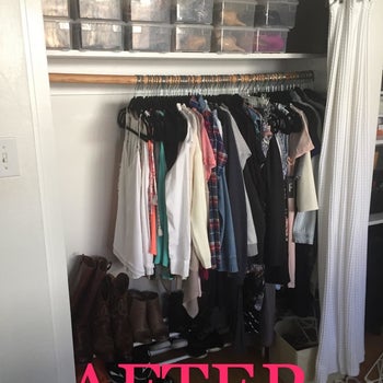 The same closet with clothes hanging on black velvet hangers. A fourth of the closet space is now left. The bar is no longer bent.