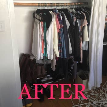 The same closet with clothes hanging on black velvet hangers. A fourth of the closet space is now left. The bar is no longer bent.