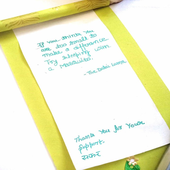 Open scroll with a letter written inside.