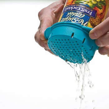 Hands using the small circular product to pour water out of a can