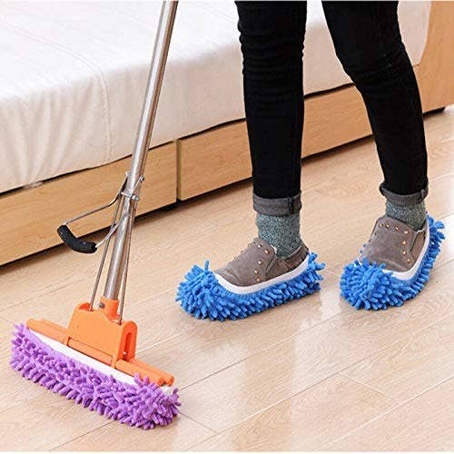 A person wearing the mop slippers and cleaning the floor.