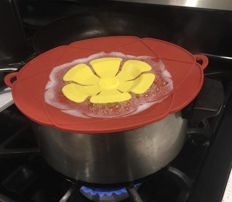 the spill stopper lid on top of a pot on the stove