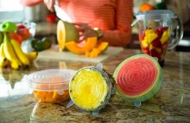 the silicone stretch lids covering half cut-open fruits 