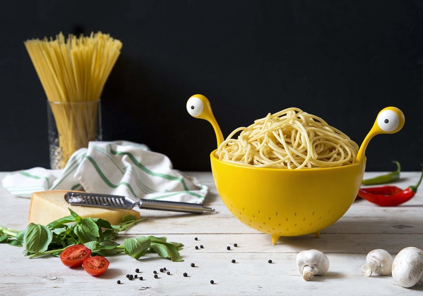 The yellow colander with handles that look like alien eye stalks with beady eyes on the ends