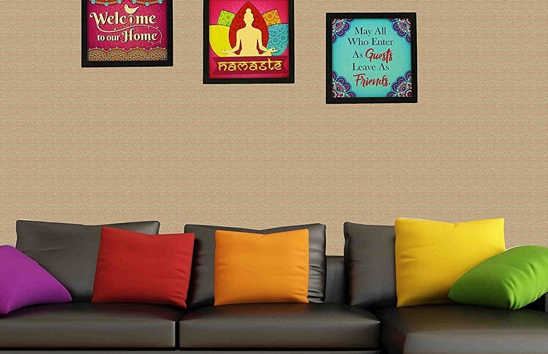 Framed art prints reading "Welcome to our home," "Namaste," and "May all who enter as guests leave as friends."