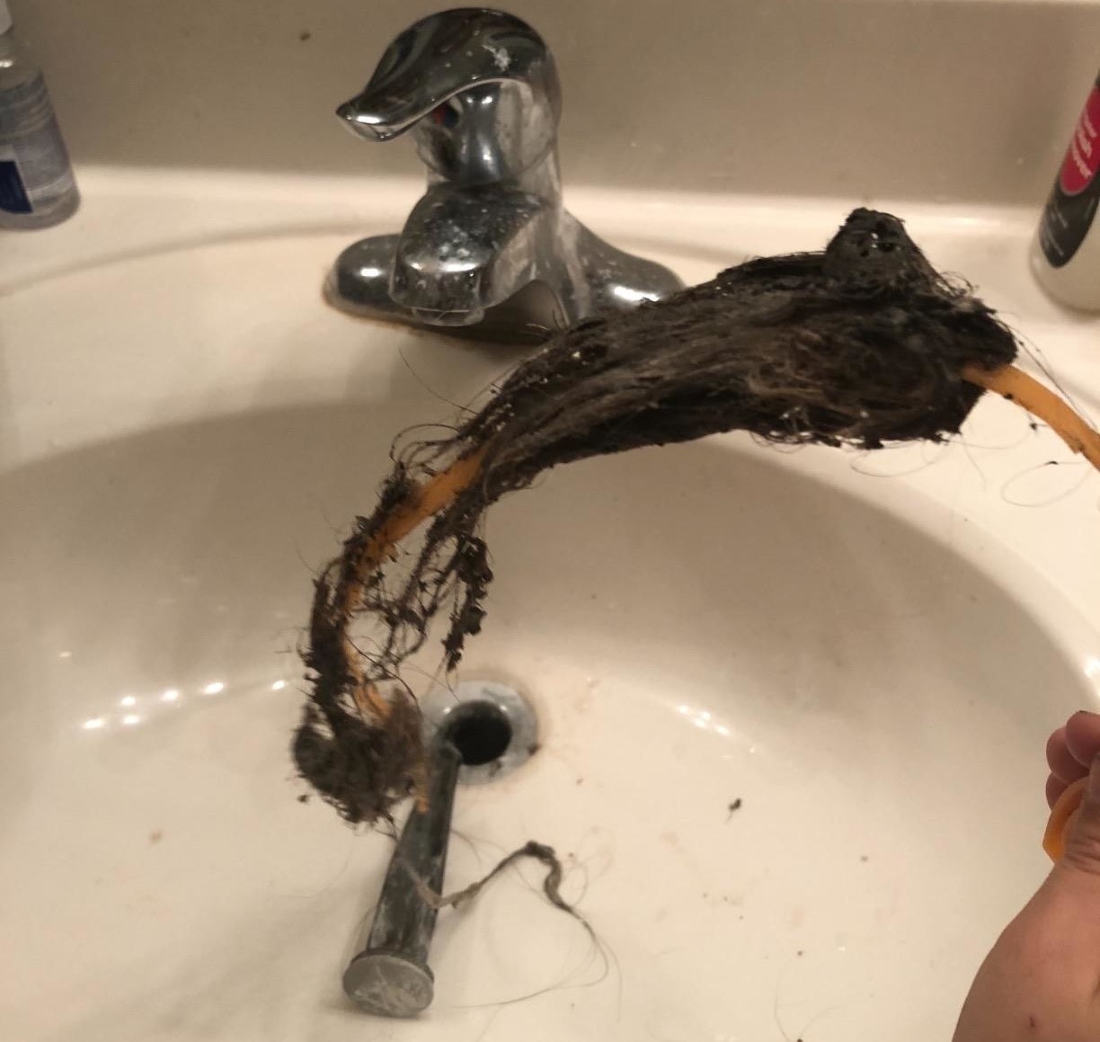 Reviewer photo showing a large clump of hair pulled out from the sink drain