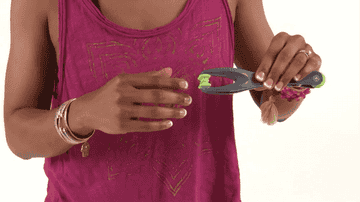 gif of model using gray and green hand massager