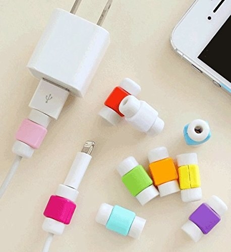 Apple phone charging wires with multicoloured cable protectors installed on them