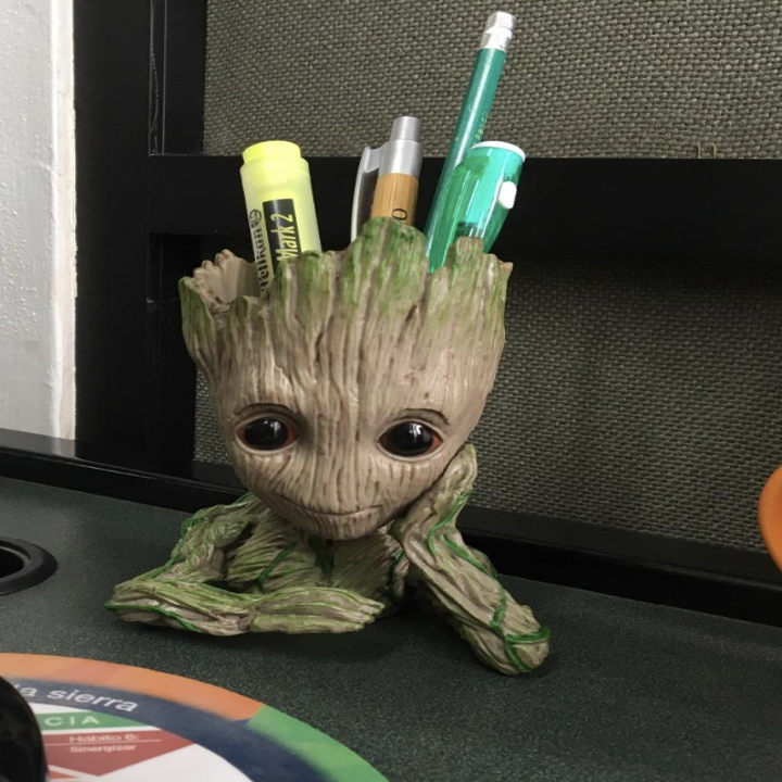 Reviewer uses same Groot planter to stash highlighters, pencils, and pens on their desk