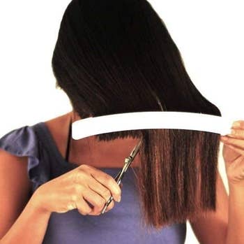 person cutting their own hair using creaclip