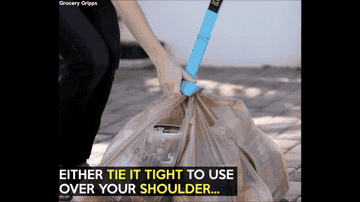 Animated gif: a model uses the strap to hook all of her grocery bags together and fastens it using a velcro adjuster before slinging the strap over her shoulder