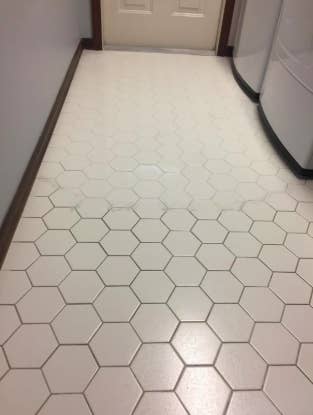 bathroom floor with half white grout and half gray dirty grout