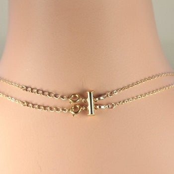 The clasp, which stacks the small-chain necklaces using their clasps at the back 