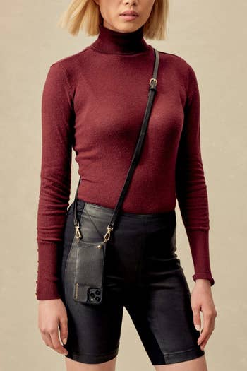 model wearing black crossbody phone case and strap