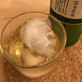 An ice skull in a whiskey glass