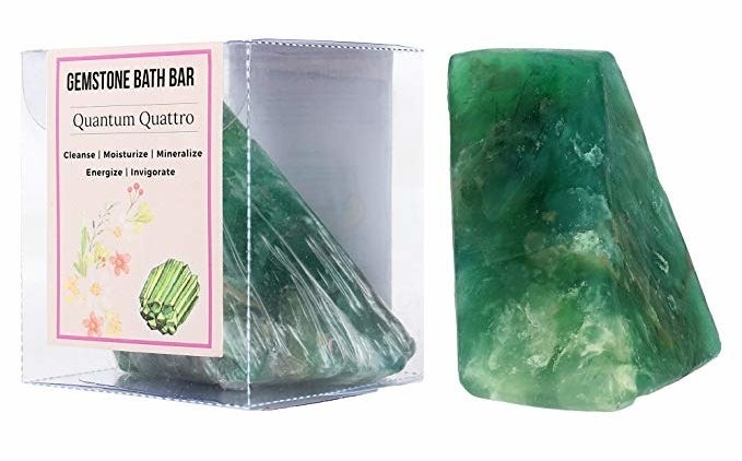 A green gemstone bath soap bar inside and outside its box